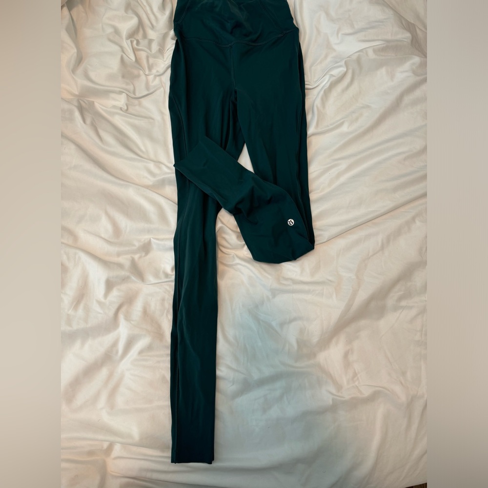 Base Pace High-Rise Running Tight
Green Jasper
Size 2